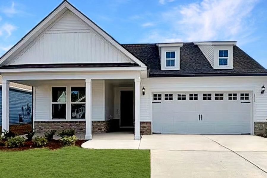 Front exterior of a new home in Crescent Cove, Myrtle Beach, SC, highlighting curb appeal (Image 17).