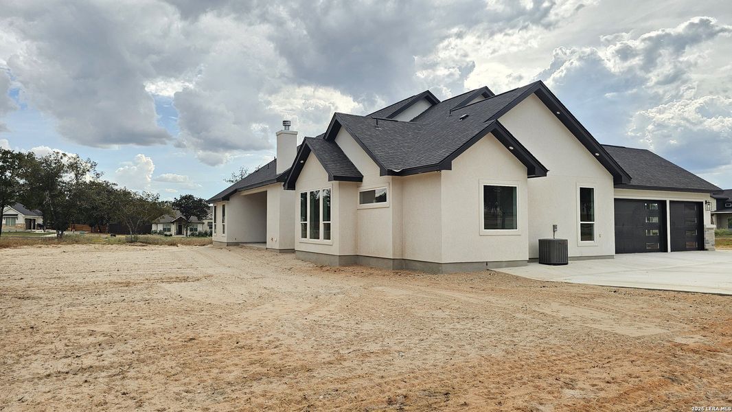 Front exterior of a new home in , Adkins, TX, highlighting curb appeal (Image 27).