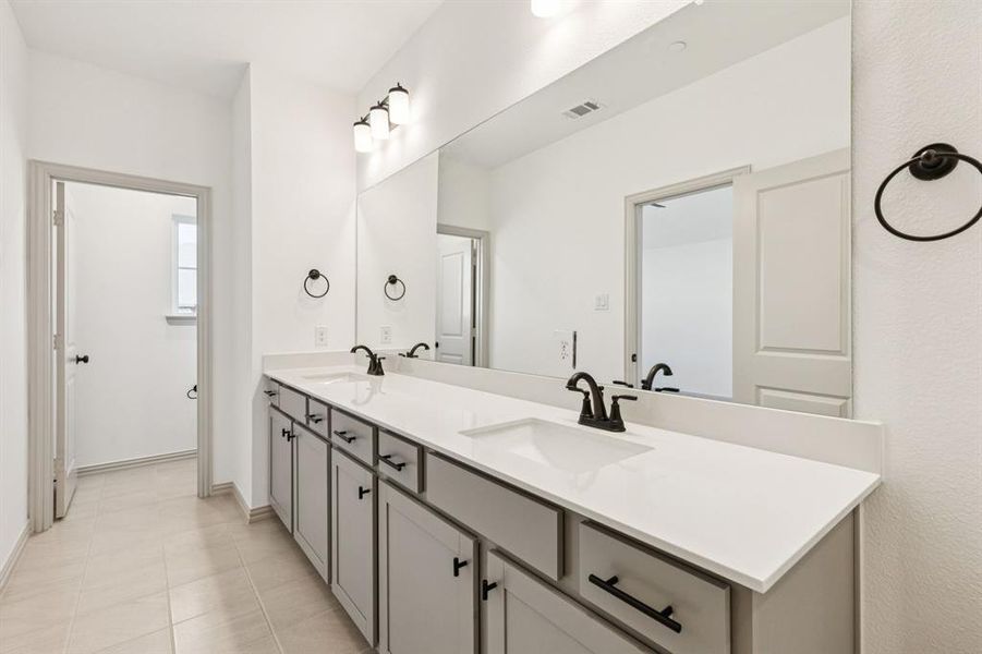 Your new owner's bath features a double vanity with plenty of space for two!