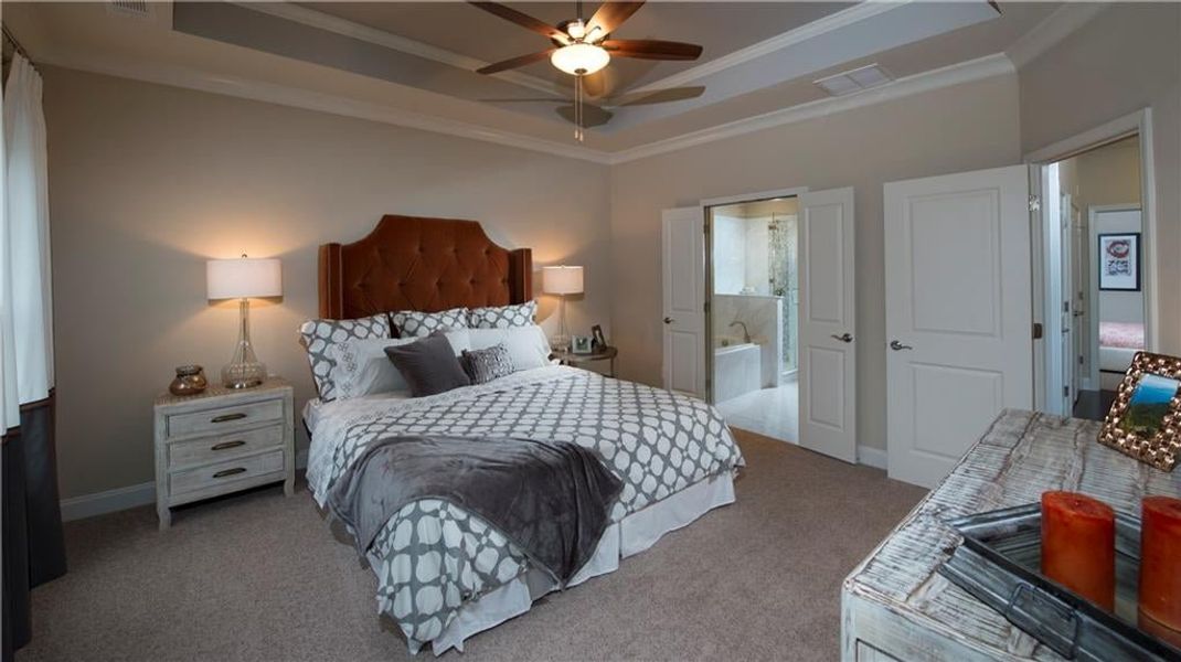 On the third level, the Owners Retreat is one of the best features in the home, with a spa-like bathroom design   featuring beautiful vanities, tiled walk-in shower with drying area and an amazing walk-in closet.  Photos are NOT of actual home, but a pre