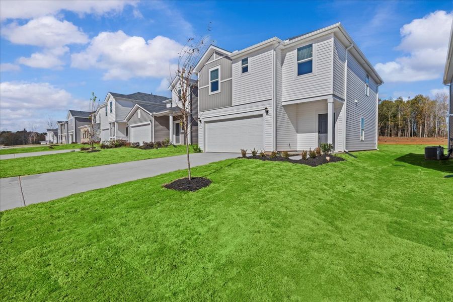 Front exterior of a new home in Creek Ridge - Heritage Collection, Spartanburg, SC, highlighting curb appeal (Image 2).