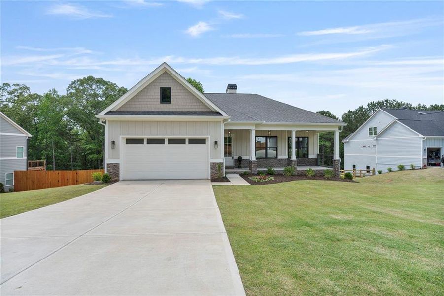 Front exterior of a new home in , Cumming, GA, highlighting curb appeal (Image 1).