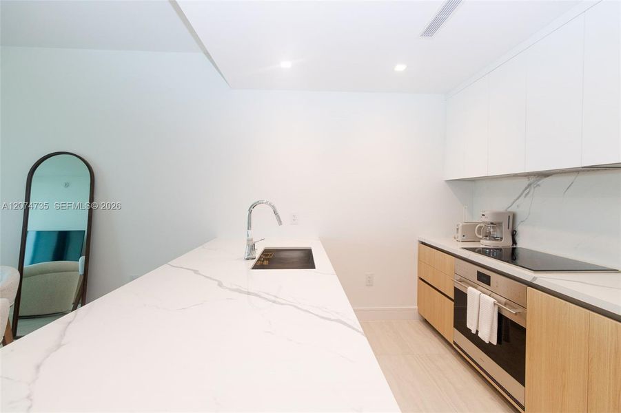 Furnished interior view inside a new home in , North Miami (Image 20).