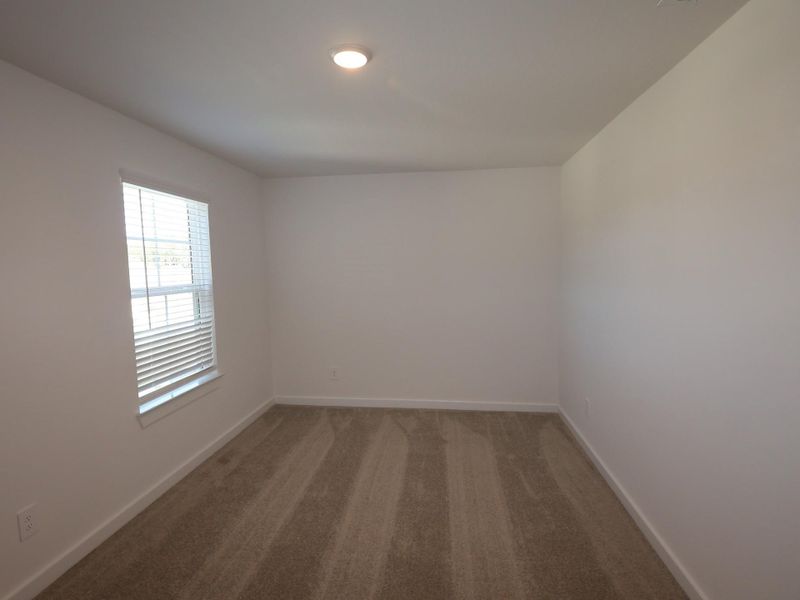 Spacious, unfurnished interior of a new home in Pinewood at Grand Texas, New Caney (Image 22).
