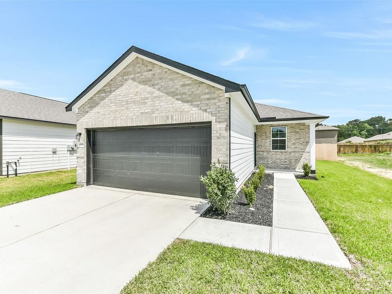 Front exterior of a new home in Liberty Estates, Cleveland, TX, highlighting curb appeal (Image 26).