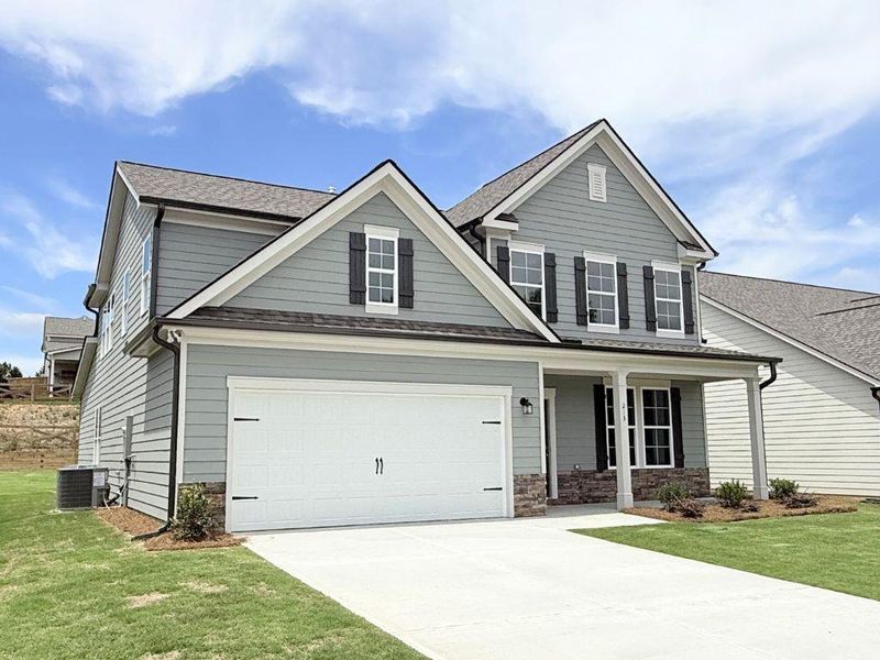 Front exterior of a new home in Sutton’s Landing, Statham, GA, highlighting curb appeal (Image 2). Front exterior of a new home in Sutton’s Landing, Statham, GA, highlighting curb appeal (Image 2).