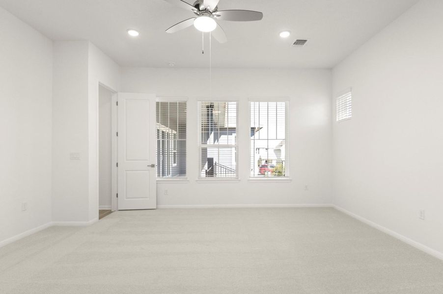 Spare room with light carpet, a ceiling fan, and recessed lighting