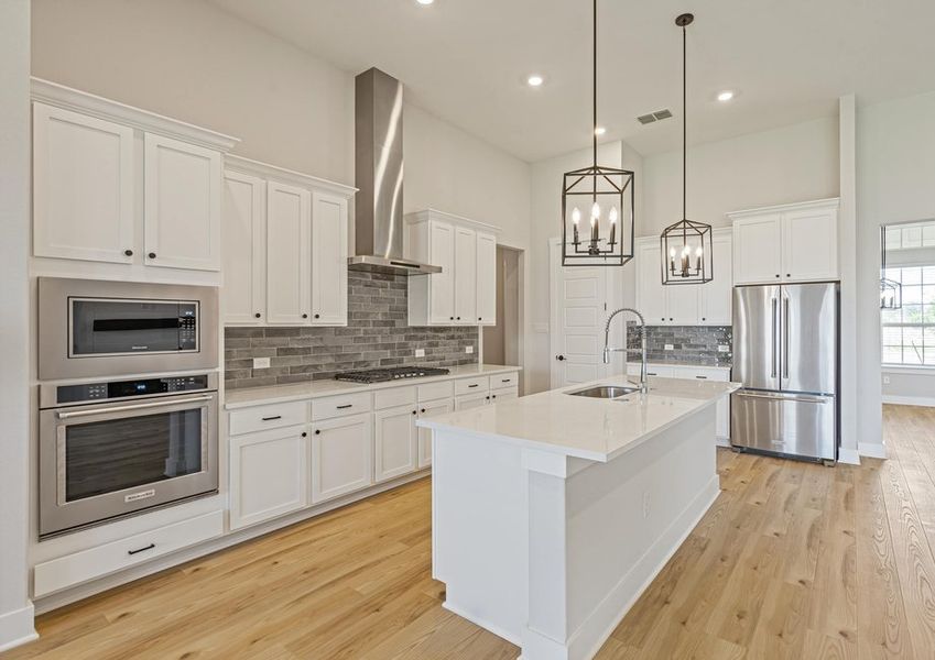 The kitchen has stainless steel appliances.