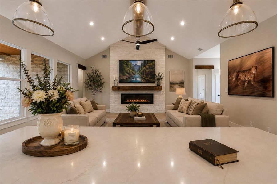 A stone fireplace anchors the living space under vaulted ceilings.Virtual Staging. A stone fireplace anchors the living space under vaulted ceilings.Virtual Staging.