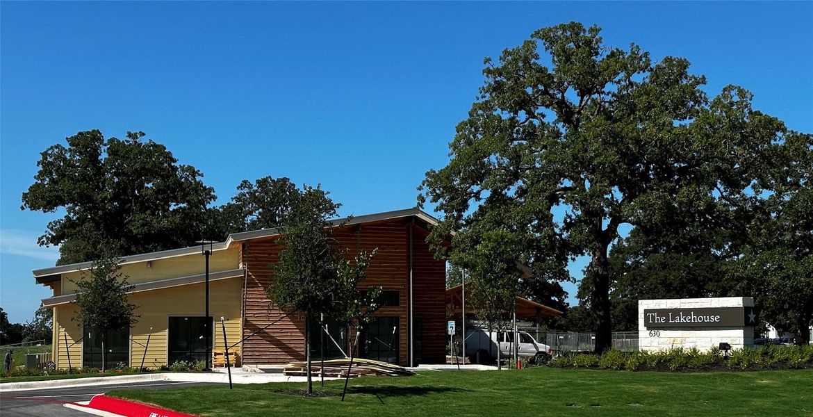 Front exterior of a new home in The Colony: Ridgepointe and Claremont Collections, Bastrop, TX, highlighting curb appeal (Image 18).