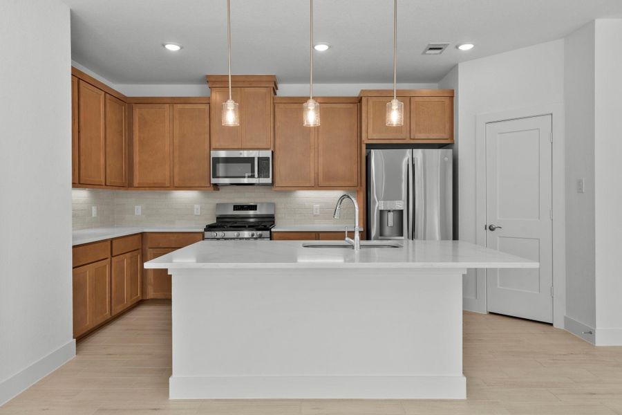 Furnished interior view inside a new home in Meridiana, Iowa Colony (Image 7).