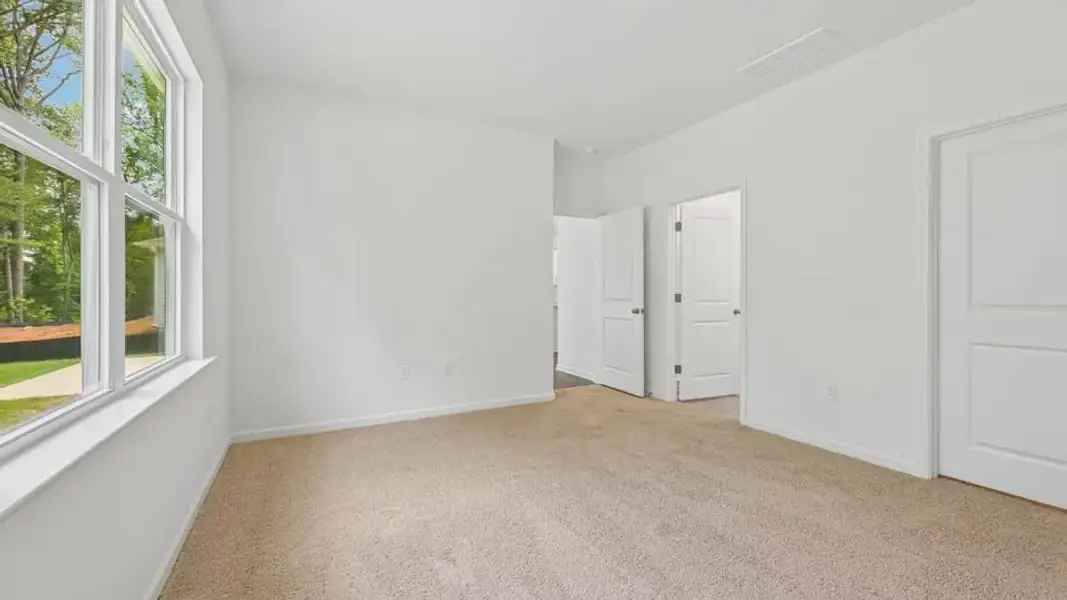 Spacious, unfurnished interior of a new home in The Villas at Laurel Oaks, Sanford (Image 18).