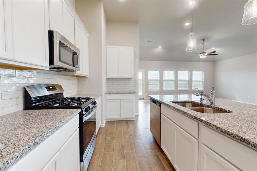 Furnished interior view inside a new home in Prairie Ridge at Goodland, Venus (Image 9).