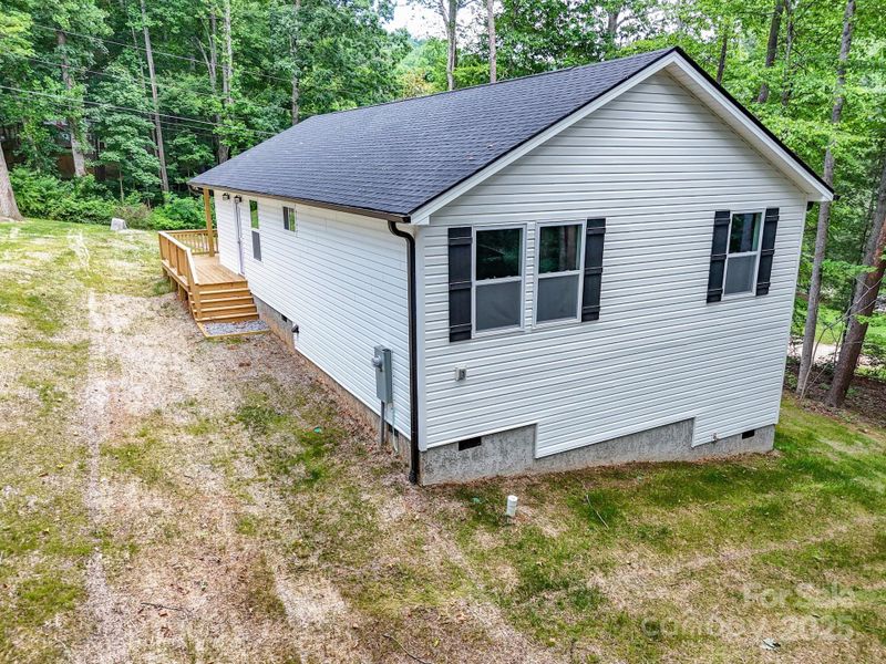 Front exterior of a new home in , Candler, NC, highlighting curb appeal (Image 20).
