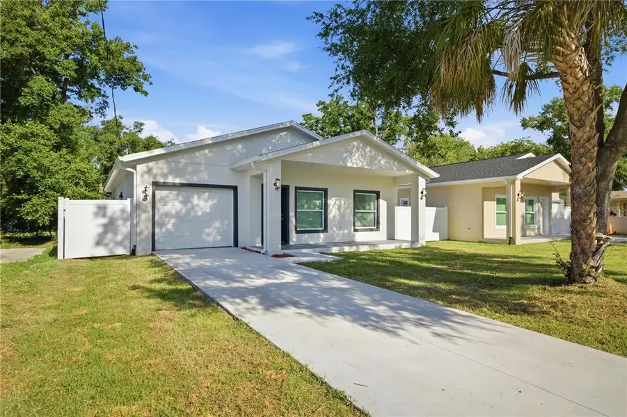 Front exterior of a new home in , Tampa, FL, highlighting curb appeal (Image 1). Front exterior of a new home in , Tampa, FL, highlighting curb appeal (Image 1).