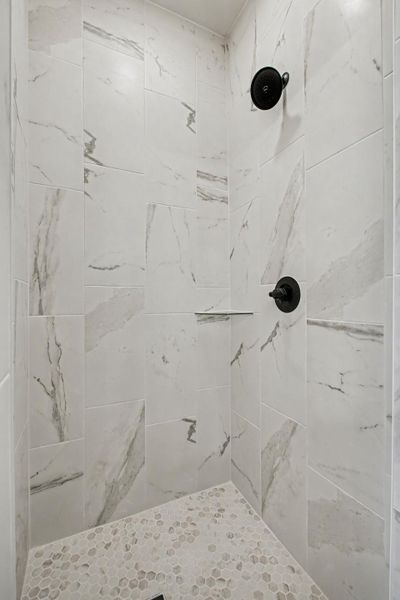Full bath featuring a stall shower