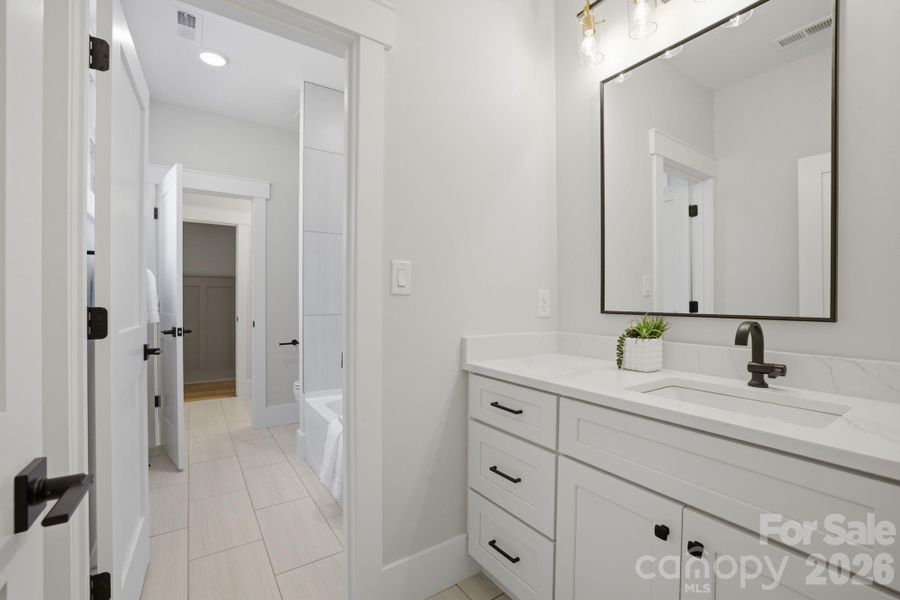 Guest Suite Shared bath with private vanity area.