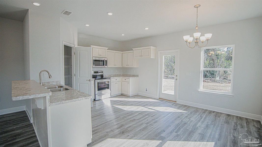 Furnished interior view inside a new home in Pine Top, Cantonment (Image 4).