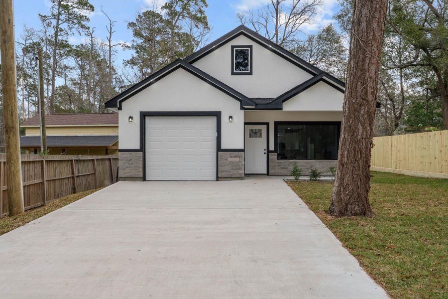 Front exterior of a new home in , Willis, TX, highlighting curb appeal (Image 20).