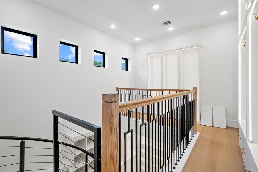 Second floor of your two-story closet features a hidden entrance and tucked space for a safe.