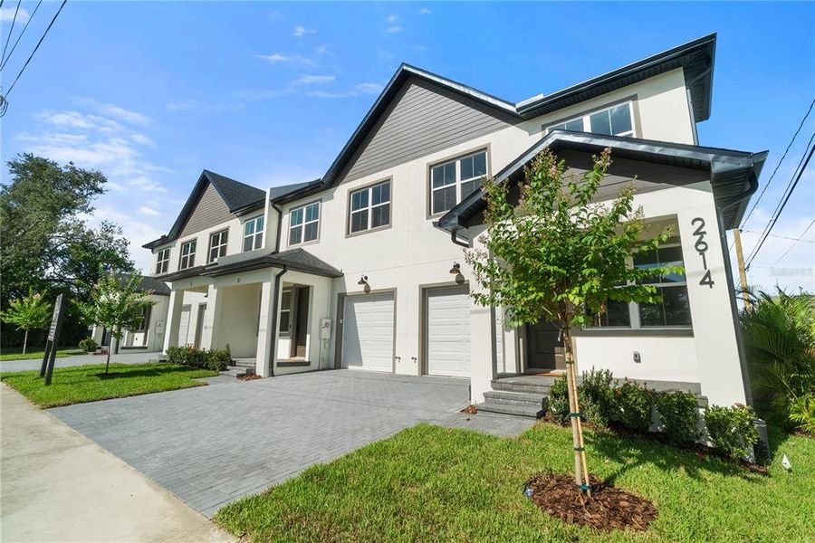 Front exterior of a new home in , Tampa, FL, highlighting curb appeal (Image 25).