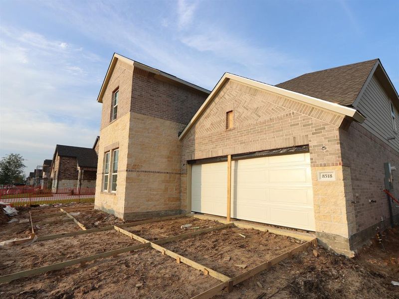 Front exterior of a new home in Marvida, Cypress, TX, highlighting curb appeal (Image 14).