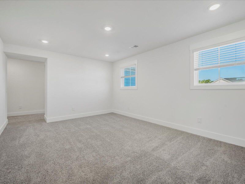 Spacious, unfurnished interior of a new home in The Coves at Lakes of Cane Bay II, Summerville (Image 16). Spacious, unfurnished interior of a new home in The Coves at Lakes of Cane Bay II, Summerville (Image 16).