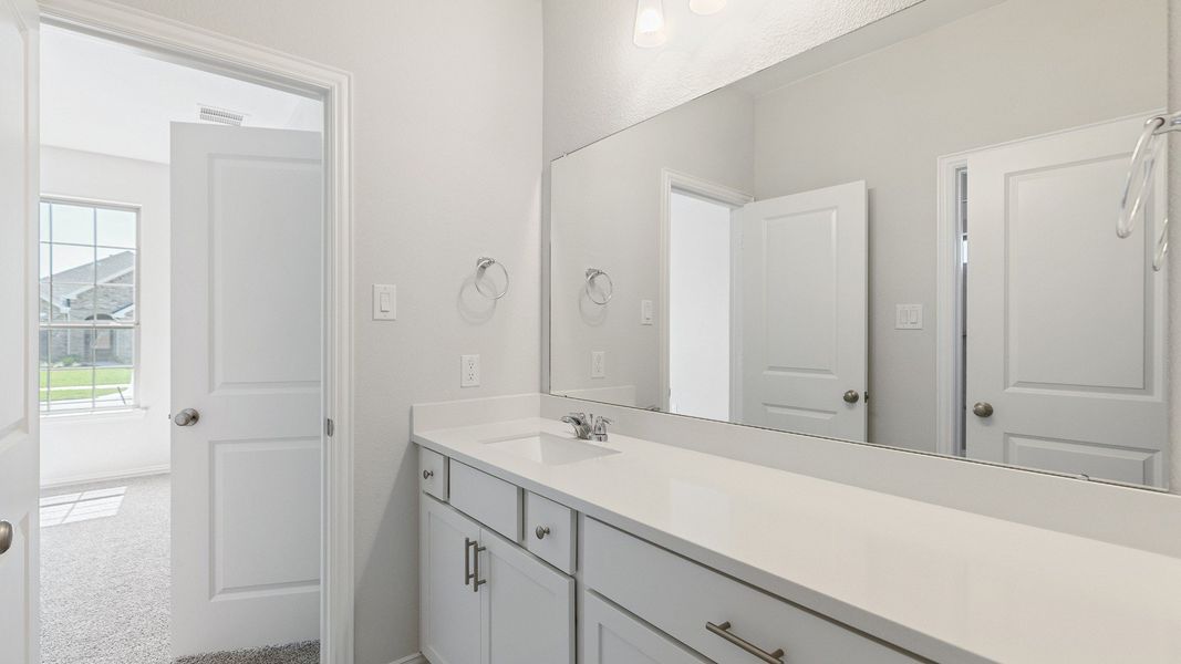 Furnished interior view inside a new home in Sunterra, Katy (Image 10).