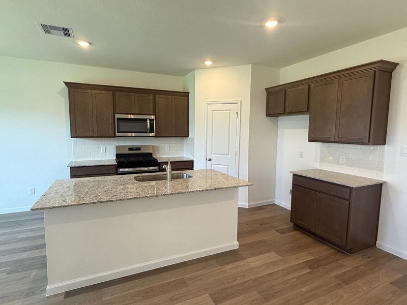 Furnished interior view inside a new home in Midtown Reserve, College Station (Image 8).