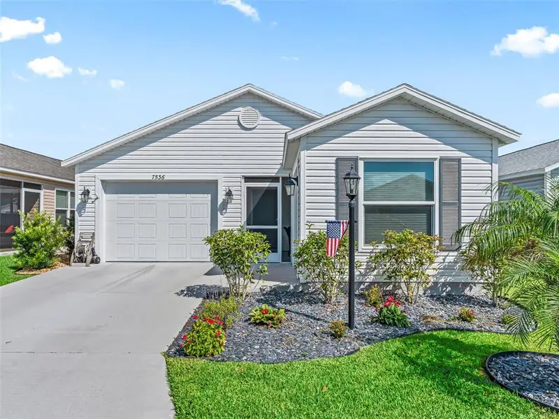 Front exterior of a new home in , The Villages, FL, highlighting curb appeal (Image 24).