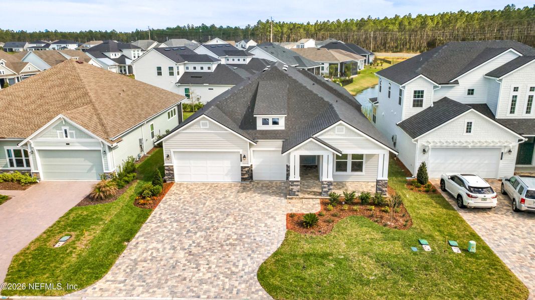 Front exterior of a new home in Middlebourne, St. Johns, FL, highlighting curb appeal (Image 17). Front exterior of a new home in Middlebourne, St. Johns, FL, highlighting curb appeal (Image 17).