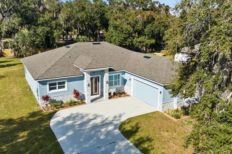 Front exterior of a new home in , Leesburg, FL, highlighting curb appeal (Image 1).