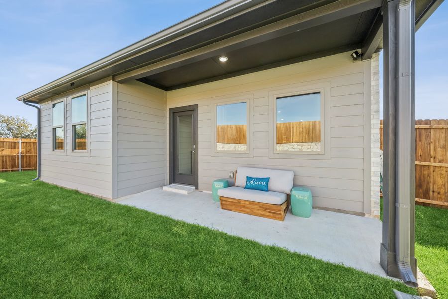 Covered Patio in a Belmont Magnolia Model Home in Aubrey TX by Trophy Signature Homes