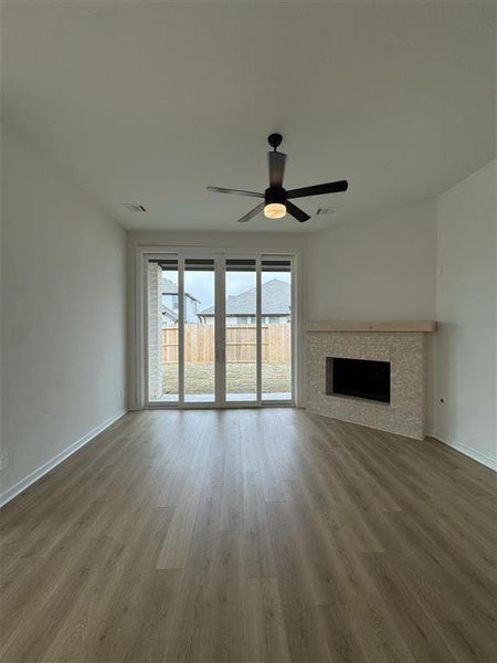 Family room with sliding glass doors and a cozy fireplace!