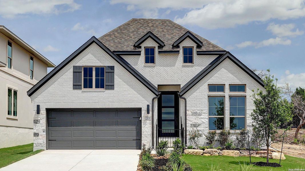 Front exterior of a new home in Esperanza, Boerne, TX, highlighting curb appeal (Image 2). Front exterior of a new home in Esperanza, Boerne, TX, highlighting curb appeal (Image 2).