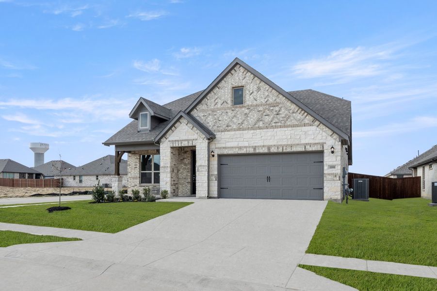 Front exterior of a new home in Timberbrook, Justin, TX, highlighting curb appeal (Image 2). Front exterior of a new home in Timberbrook, Justin, TX, highlighting curb appeal (Image 2).