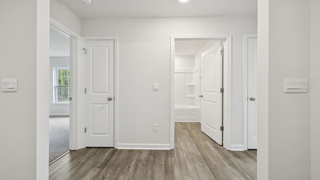 Spacious, unfurnished interior of a new home in Bentley Park, Greenwood (Image 13).