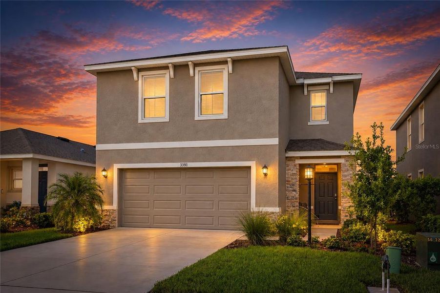 Front exterior of a new home in Star Farms at Lakewood Ranch, Bradenton, FL, highlighting curb appeal (Image 1). Front exterior of a new home in Star Farms at Lakewood Ranch, Bradenton, FL, highlighting curb appeal (Image 1).