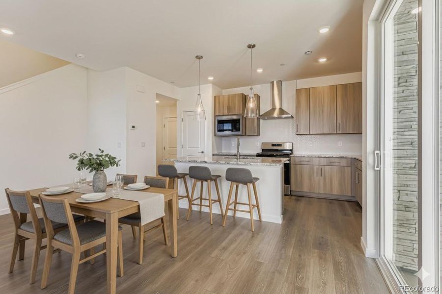 virtually staged dining / kitchen