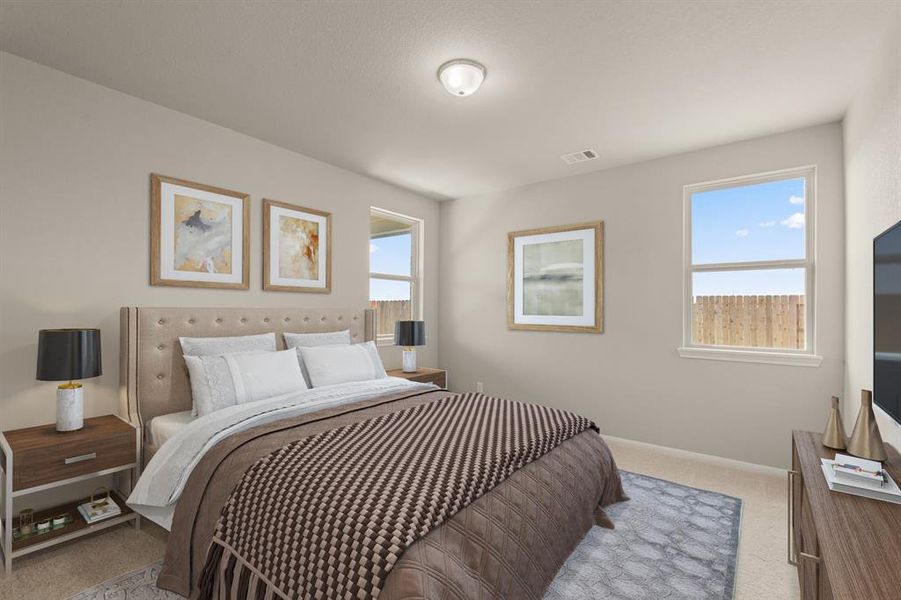 The primary bedroom is generously sized, creating a tranquil and spacious retreat that offers ample room for relaxation. Featuring plush carpet, high ceilings, fresh paint, and large windows that lets in natural lighting throughout the day.