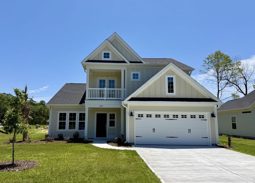 Front exterior of a new home in Indigo at Abbey Preserve, Wilmington, NC, highlighting curb appeal (Image 1). Front exterior of a new home in Indigo at Abbey Preserve, Wilmington, NC, highlighting curb appeal (Image 1).
