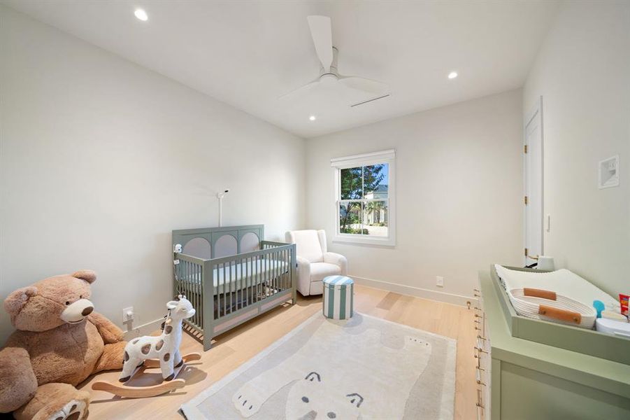 Another wonderful guest bedroom on the second floor with wood floor, large closet and ceiling fan.