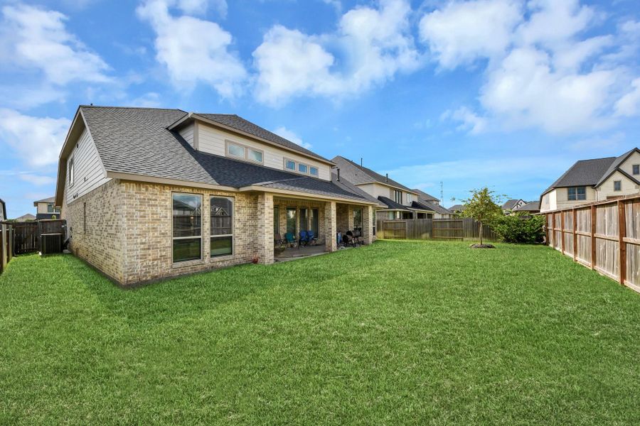 Exterior details and patio area of a home in Legacy Prairie at Katy Court, Katy (Image 26).