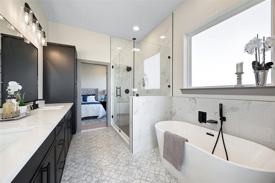 Bathroom with vanity, tile walls, and shower with separate bathtub