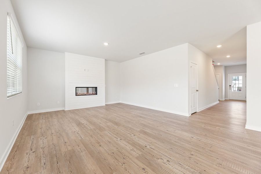 A room with a wood floor and a wood floor.