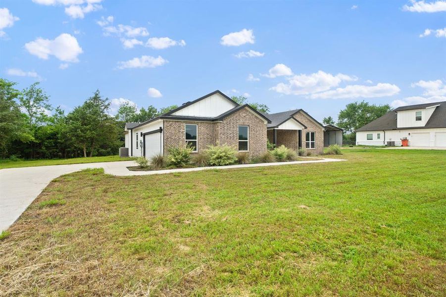 Front exterior of a new home in , Greenville, TX, highlighting curb appeal (Image 22).