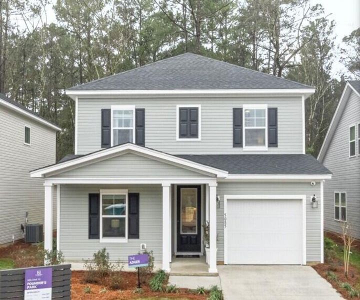 Front exterior of a new home in Founder's Park, Summerville, SC, highlighting curb appeal (Image 1). Front exterior of a new home in Founder's Park, Summerville, SC, highlighting curb appeal (Image 1).