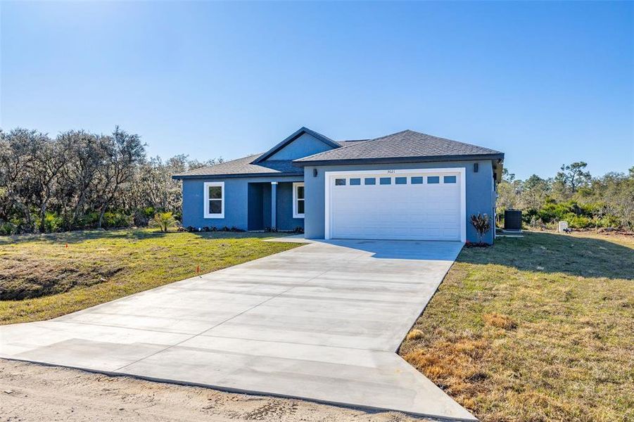 Front exterior of a new home in , Avon Park, FL, highlighting curb appeal (Image 2). Front exterior of a new home in , Avon Park, FL, highlighting curb appeal (Image 2).