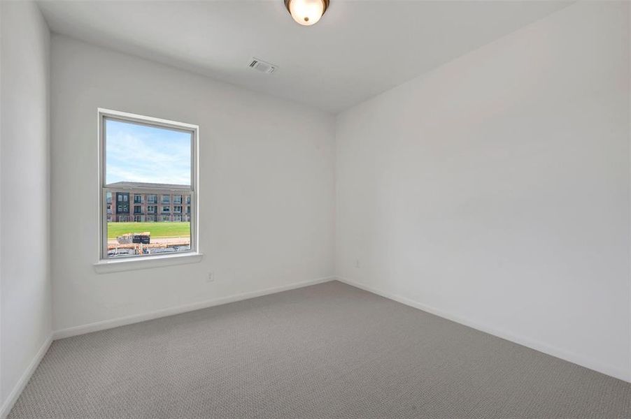 Bright interior room with white walls and gray carpet Bright interior room with white walls and gray carpet