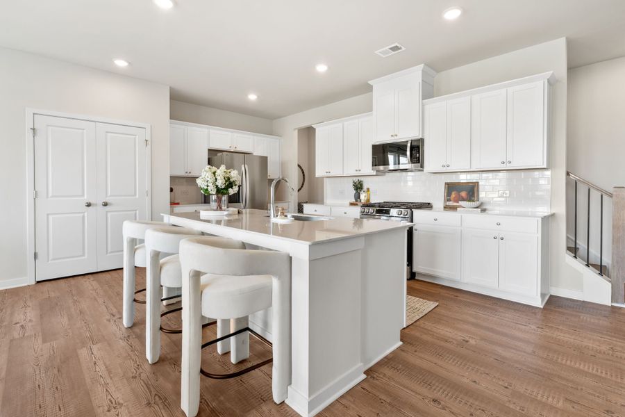 A kitchen with white cabinets. A kitchen with white cabinets.
